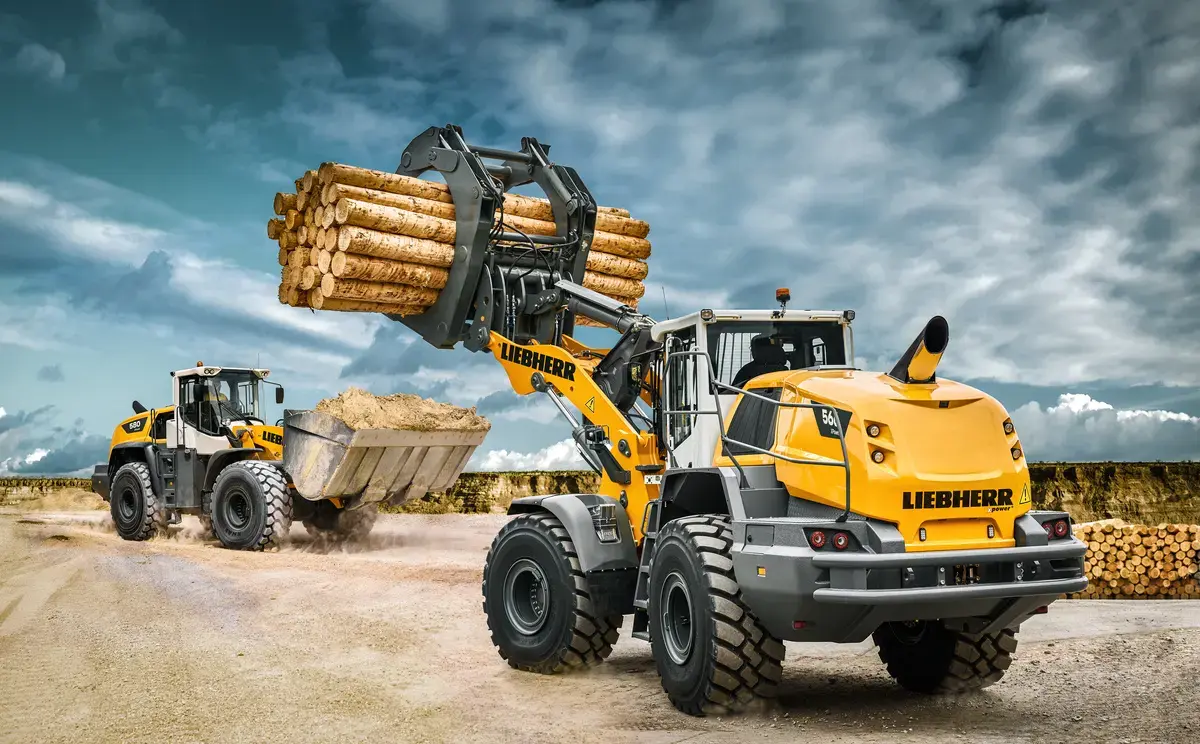 Chargeuse sur pneus Liebherr L 566 XPower — vue de profil avec godet de charge